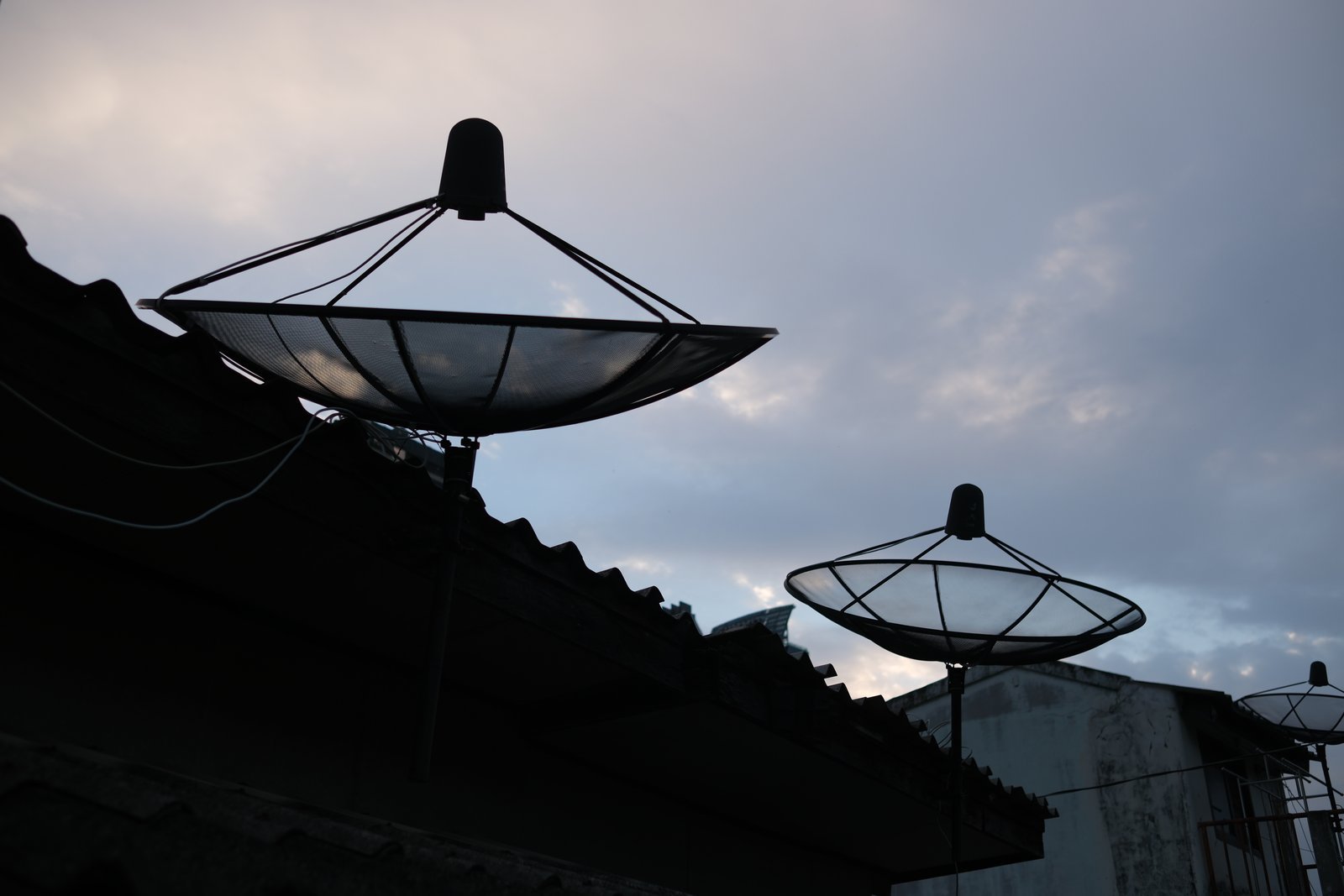 Satellite dishes crowd the rooftops of Ban Khrua, the Cham Muslim silk quarter where Jim Thompson's Bangkok began