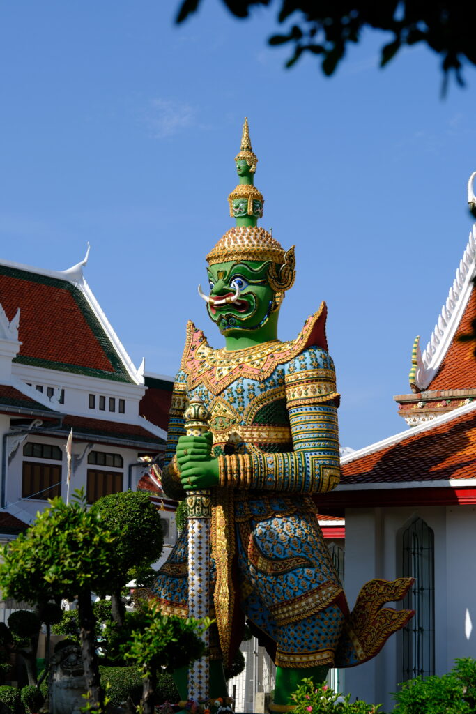 Thotsakan, the green giant guardian of the Ramakien, standing at the gate of Wat Arun