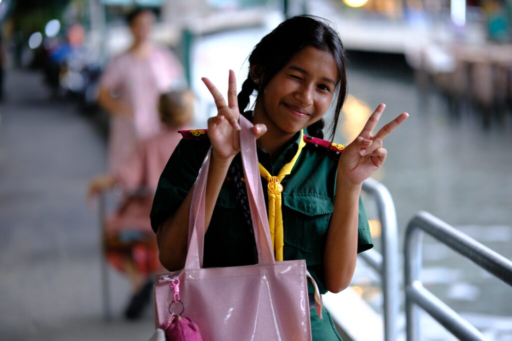 Schoolgirl in scout uniform at a Khlong Saen Saep pier