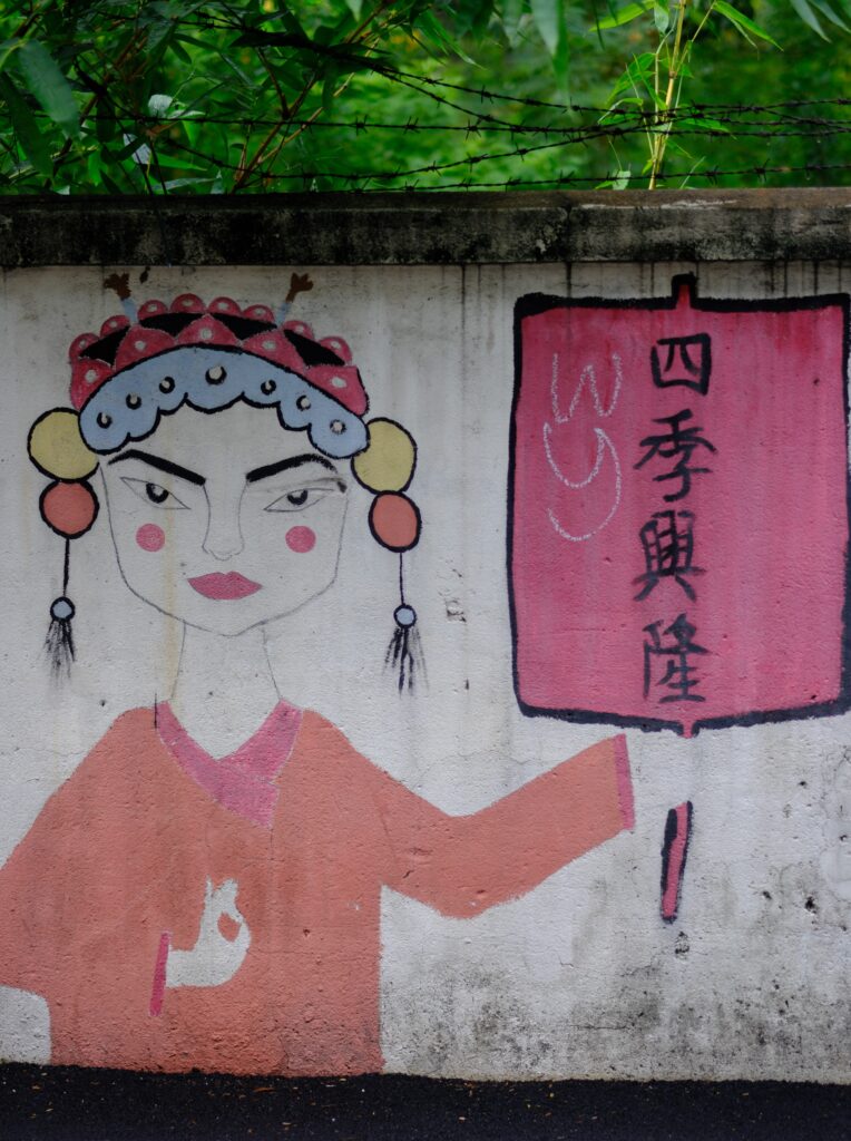 Graffiti of a Chinese opera figure on a wall near Teochew Cemetery Park